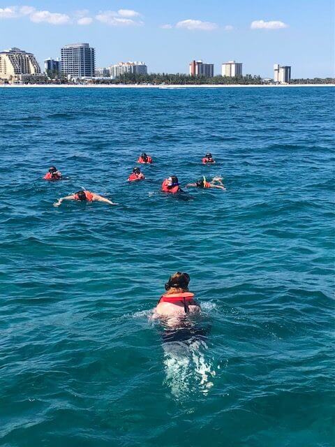 Clients snorkeling on the coral reef in Florida